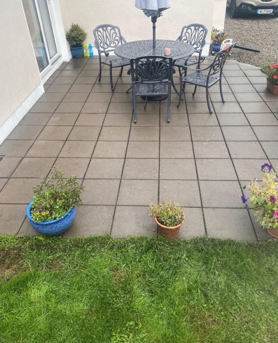 Patio after pressure washing — clean even slabs